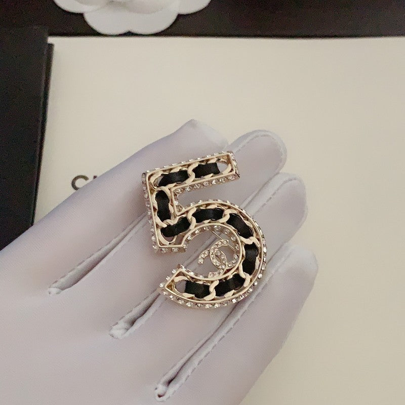 Chanel No.5 Leather Diamond Brooch