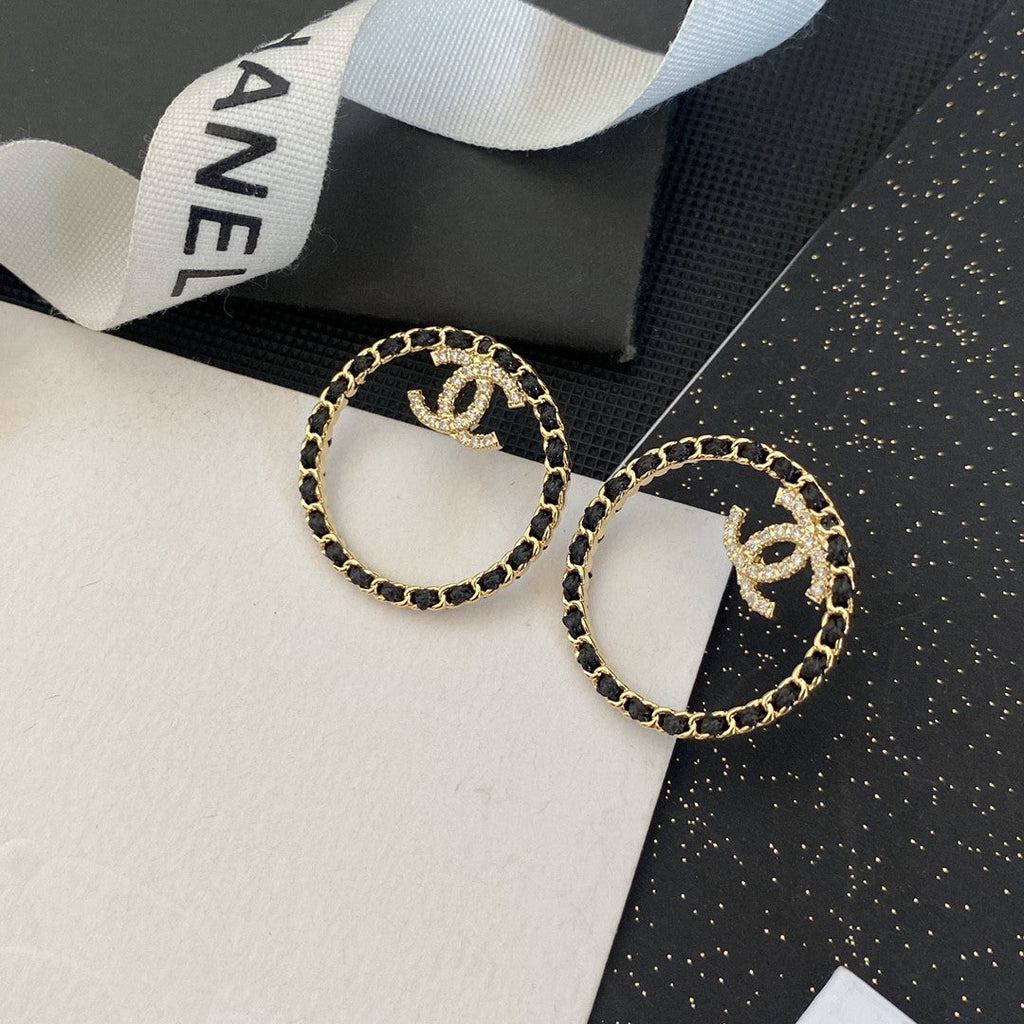 Chanel Black Leather Circle Earrings - 18K Yellow Gold