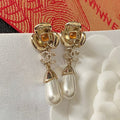 Chanel Camellia Pearl Earrings - 18K Yellow Gold