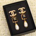 Chanel Long Pearl Pendant Earrings - 18K Yellow Gold