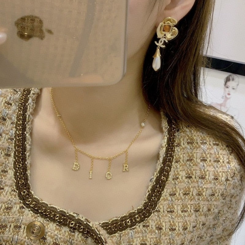 Chanel Camellia Pearl Earrings - 18K Yellow Gold