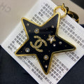 Chanel Black Gold Star Brooch