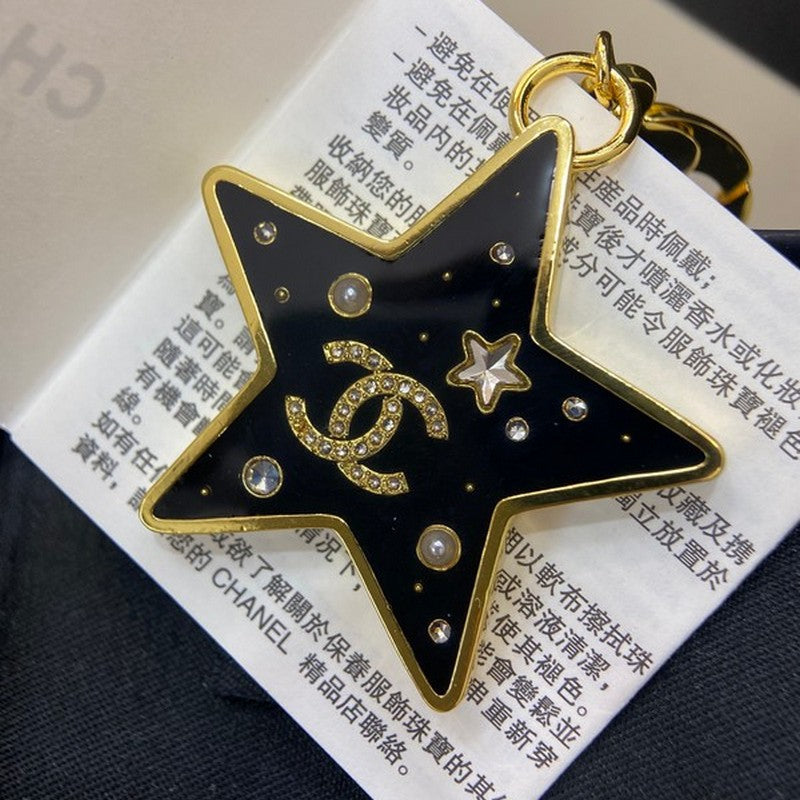 Chanel Black Gold Star Brooch