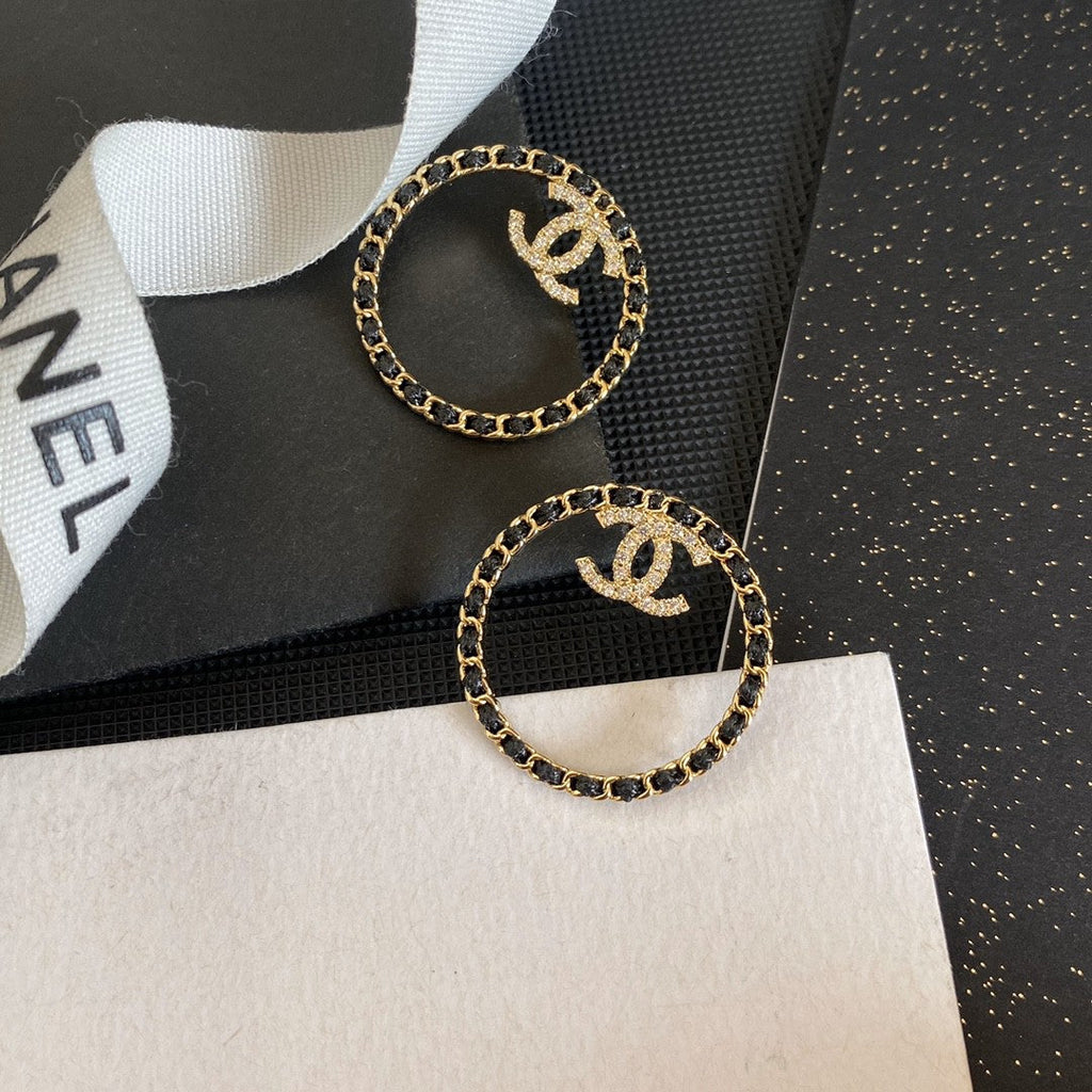 Chanel Black Leather Circle Earrings - 18K Yellow Gold
