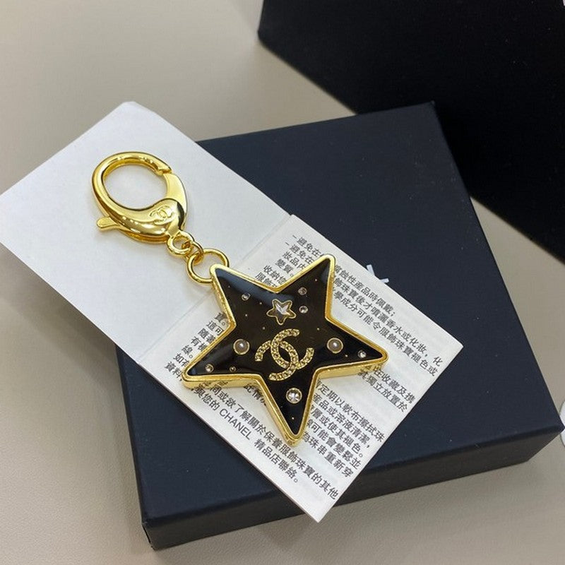 Chanel Black Gold Star Brooch