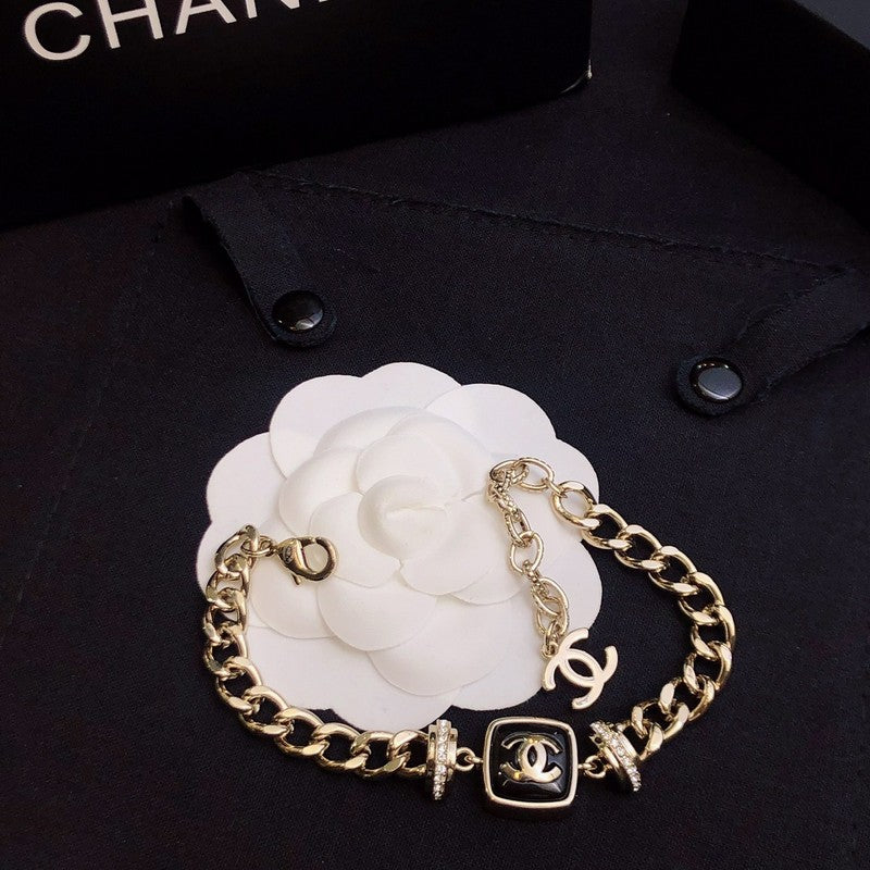 Chanel Black Logo Gold Chain Bracelet
