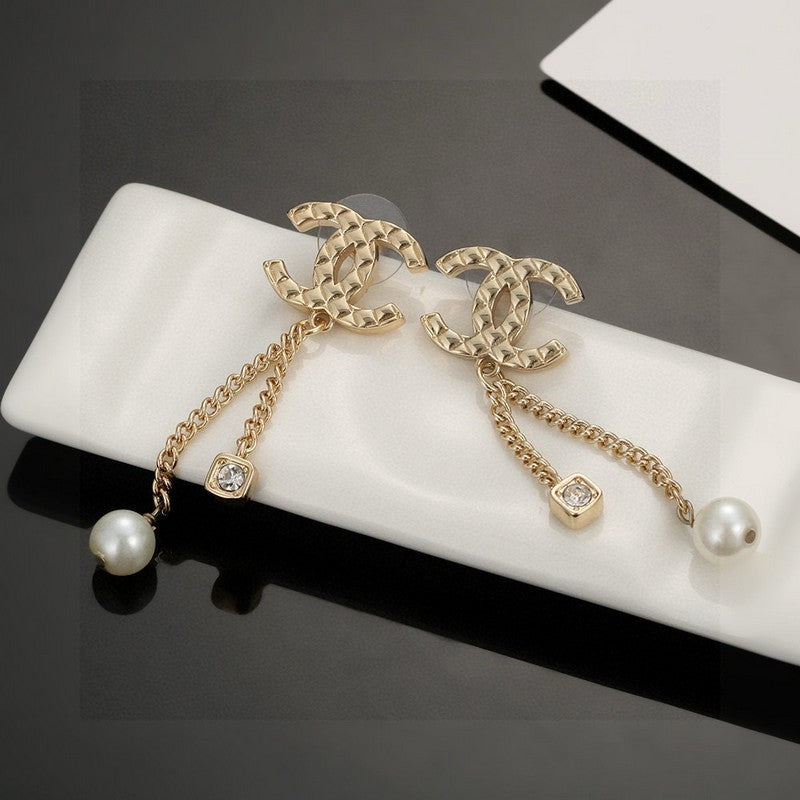 Chanel Long Pearl Pendant Earrings - 18K Yellow Gold