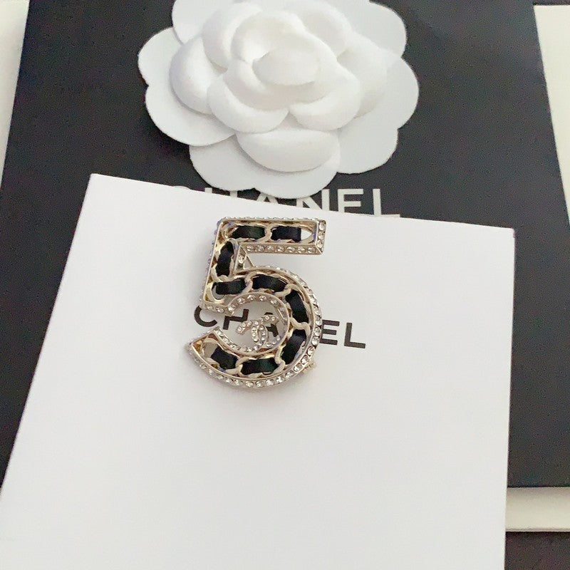Chanel No.5 Leather Diamond Brooch