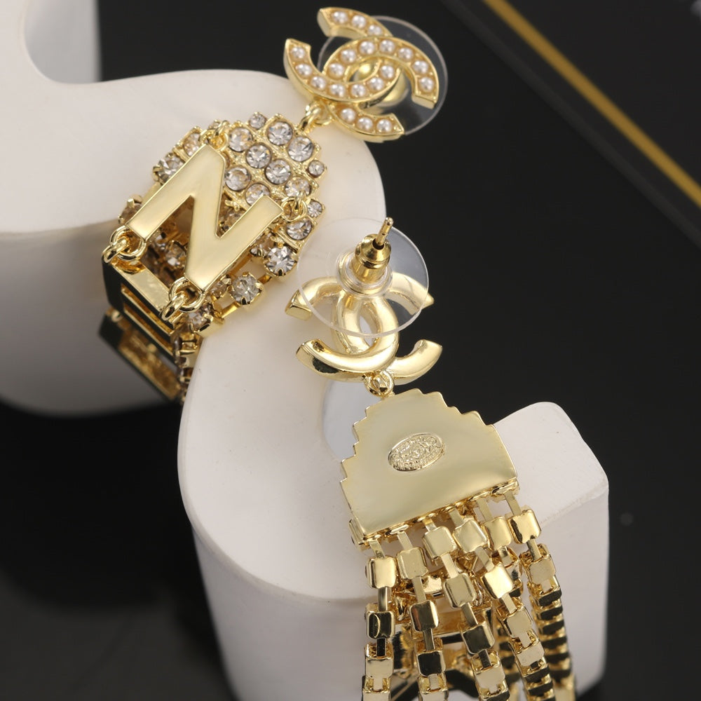 Chanel Letter Earrings - 18K Yellow Gold