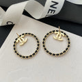 Chanel Black Leather Circle Earrings - 18K Yellow Gold