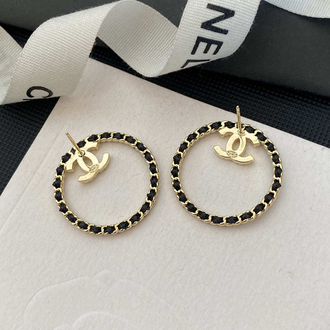 Chanel Black Leather Circle Earrings - 18K Yellow Gold
