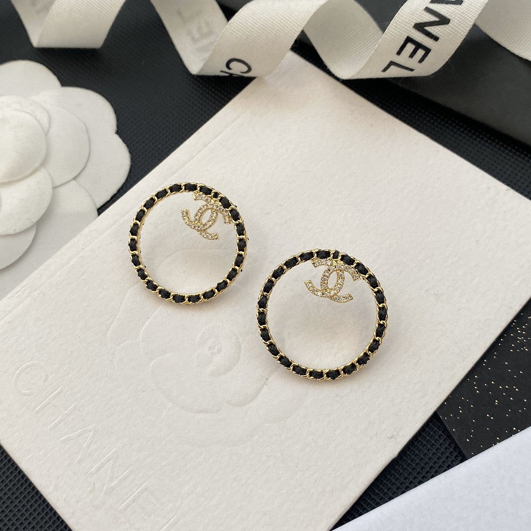 Chanel Black Leather Circle Earrings - 18K Yellow Gold