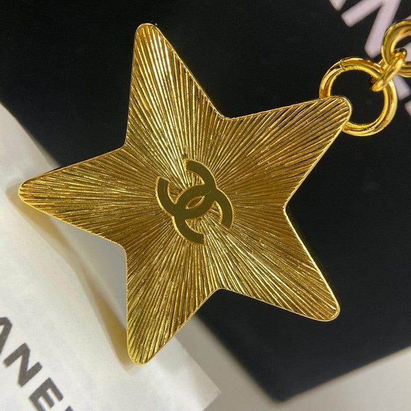 Chanel Black Gold Star Brooch