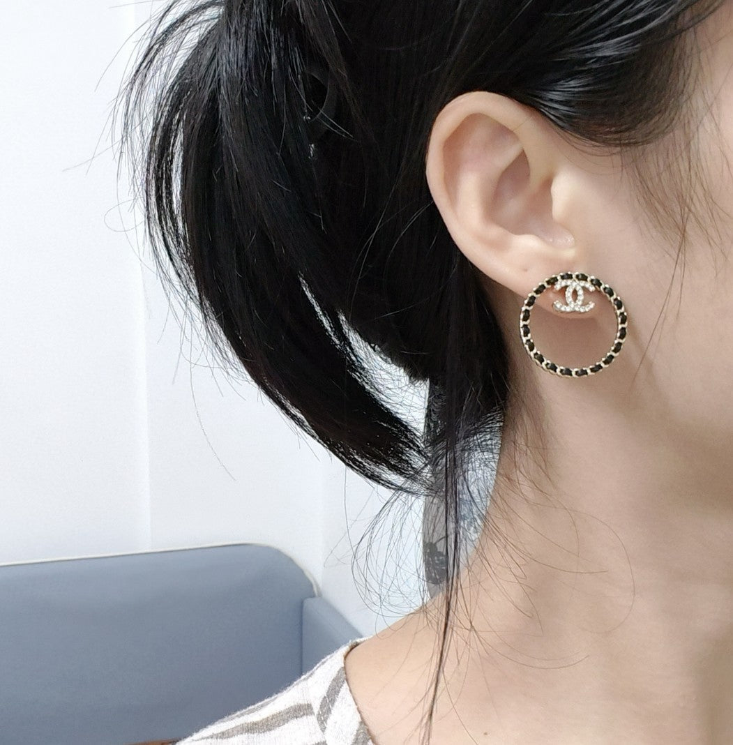 Chanel Black Leather Circle Earrings - 18K Yellow Gold