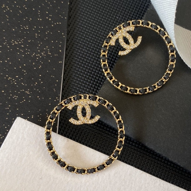 Chanel Black Leather Circle Earrings - 18K Yellow Gold